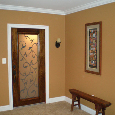 Example of a mid-sized arts and crafts porcelain tile wine cellar design in DC Metro with diamond bins