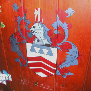 Wine cellar - family crest painted on wood.