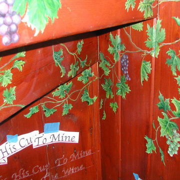 Wine cellar - grape vines painted on wood.