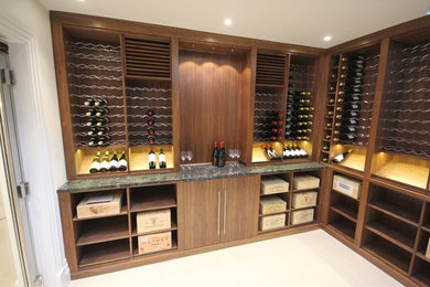 Photo of a large contemporary wine cellar in Other with marble flooring and display racks.