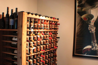 Example of a transitional wine cellar design in Other