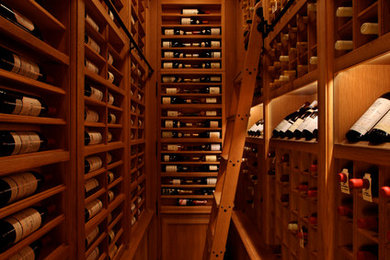 Example of a large classic brick floor wine cellar design in New York with storage racks