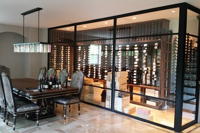 Example of a large transitional beige floor and ceramic tile wine cellar design in Austin with display racks