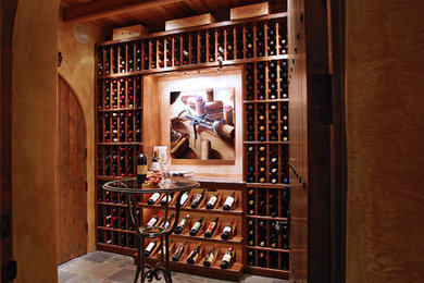 Inspiration for a large timeless slate floor wine cellar remodel in Portland with storage racks
