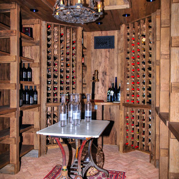 Wine Cellar with Reclaimed Oak walls, ceiling & shelving & Brick Floor
