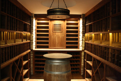Inspiration for a mid-sized craftsman brick floor wine cellar remodel in Los Angeles with storage racks