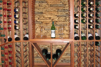 Example of a mountain style wine cellar design in New York