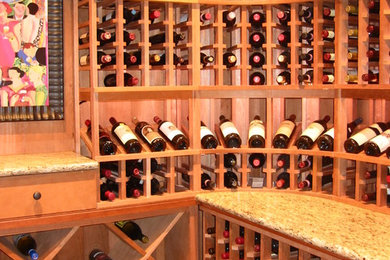 Medium sized rustic wine cellar in Atlanta with display racks.