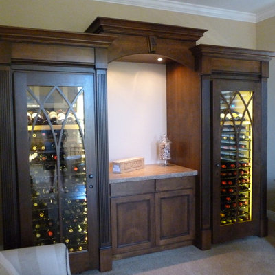 Inspiration for a mid-sized craftsman carpeted and beige floor wine cellar remodel in San Francisco with storage racks