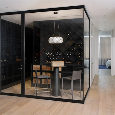 Wine cellar - mid-sized contemporary light wood floor and beige floor wine cellar idea in New York with diamond bins