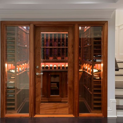 Example of a small classic black floor wine cellar design in New York with display racks