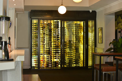 Photo of a small modern wine cellar in Gold Coast - Tweed with storage racks.