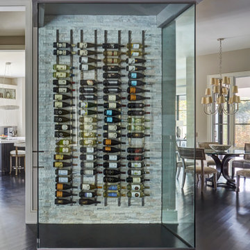 Wine Wall with Glass Walls and Stacked Stone Tile Backsplash