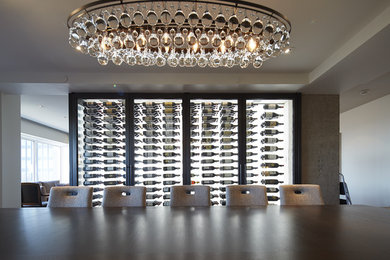 Example of a wine cellar design in Montreal with storage racks