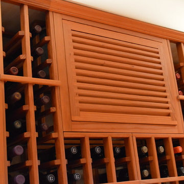 Wooden louvered grill for the wine cellar cooling unit
