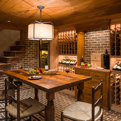 Elegant brick floor and red floor wine cellar photo in Philadelphia