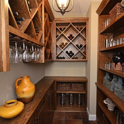 Inspiration for a small timeless brown floor wine cellar remodel in Minneapolis with diamond bins