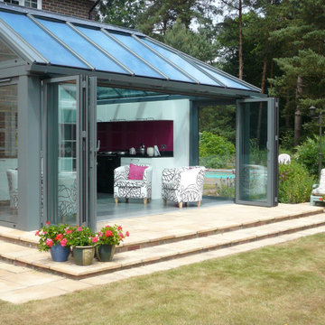 Glasfalttüren von Sunflex für Wintergarten mit Küche