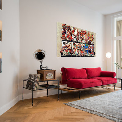 Family room - small eclectic open concept light wood floor and brown floor family room idea in Berlin with a music area and gray walls