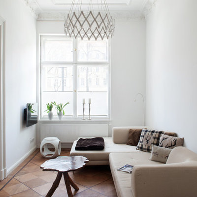 Inspiration for a small eclectic enclosed medium tone wood floor family room remodel in Berlin with white walls, no fireplace and a wall-mounted tv