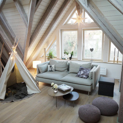 Small danish enclosed light wood floor and brown floor family room photo in Other with white walls, no fireplace and no tv
