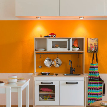 Kinderspielbereich im Wohnzimmer - in gute Laune Orange.