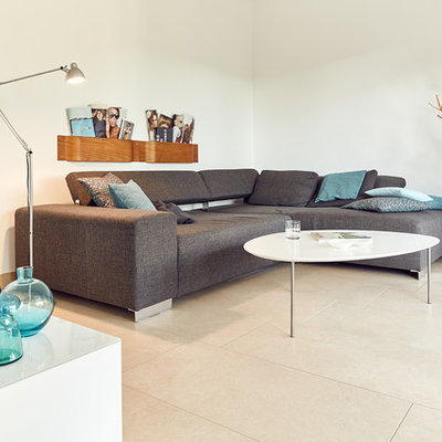 Inspiration for a small scandinavian enclosed ceramic tile and beige floor family room remodel in Nuremberg with white walls, no fireplace and no tv