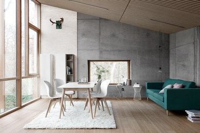 Свежая идея для дизайна: открытая гостиная комната среднего размера в современном стиле с белыми стенами и коричневым полом без телевизора - отличное фото интерьера