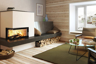 Ejemplo de sala de estar abierta contemporánea de tamaño medio sin televisor con paredes blancas, estufa de leña, marco de chimenea de yeso y suelo marrón