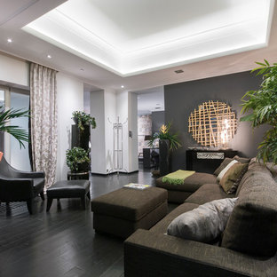 Diseño de salón para visitas abierto, actual, pequeño, sin chimenea y televisor, con paredes grises, suelo de madera oscura y suelo negro