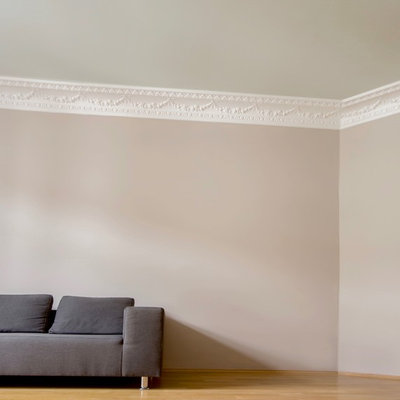 Inspiration for a mid-sized scandinavian enclosed medium tone wood floor and brown floor family room remodel with beige walls and no tv