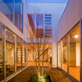 Idee per una terrazza etnica in cortile con nessuna copertura