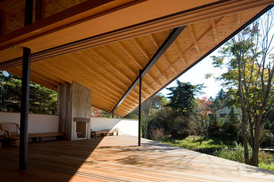 Ejemplo de terraza de estilo zen extra grande en anexo de casas