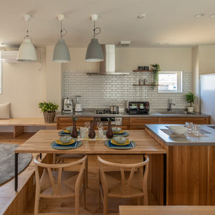 Asian eat-in kitchen remodeling - Eat-in kitchen - asian galley medium tone wood floor and beige floor eat-in kitchen idea in Tokyo Suburbs with a single-bowl sink, shaker cabinets, medium tone wood cabinets, stainless steel countertops, white backsplash, subway tile backsplash, white appliances, an island and gray countertops