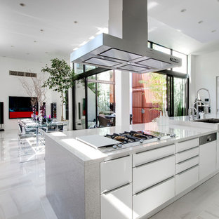 Inspiration for a large contemporary single-wall open plan kitchen in Tokyo with an undermount sink, flat-panel cabinets, white cabinets, terrazzo benchtops, stainless steel appliances, marble floors, with island and grey floor.