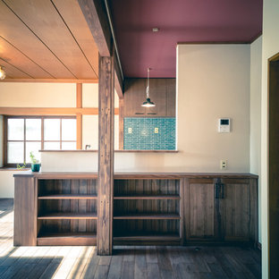 Design ideas for a mid-sized midcentury single-wall open plan kitchen in Other with a single-bowl sink, flat-panel cabinets, brown cabinets, stainless steel benchtops, green splashback, porcelain splashback, stainless steel appliances, dark hardwood floors, with island, beige benchtop and brown floor.