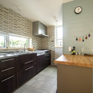Photo of a modern kitchen in Other with a single-bowl sink, flat-panel cabinets, dark wood cabinets and with island.