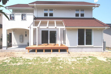 Inspiration for a mediterranean front patio in Other with decking and a pergola.