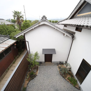Immagine di un grande patio o portico etnico in cortile con ghiaia e nessuna copertura