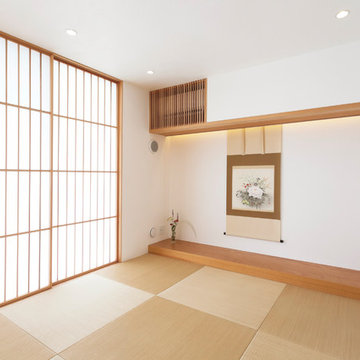 平屋と二階建てが土間で繋がる二世帯住宅