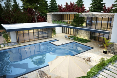 Diseño de casa de la piscina y piscina infinita tropical rectangular en patio con entablado