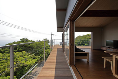 This is an example of a world-inspired wire cable railing balcony in Other with no cover.
