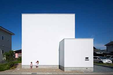 Idée de décoration pour une façade de maison minimaliste.