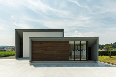 Diseño de fachada gris actual con tejado plano