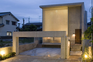 Diseño de fachada de casa moderna de dos plantas con tejado plano