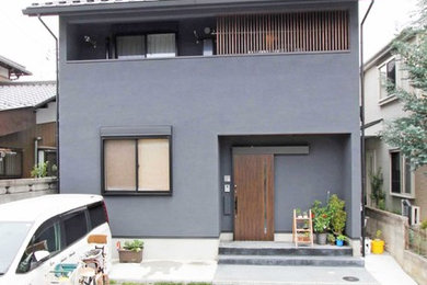 Black two-story exterior home photo in Tokyo Suburbs with a metal roof