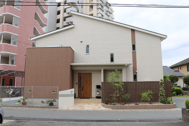 Medium sized and beige modern two floor detached house in Other with mixed cladding, a lean-to roof and a mixed material roof.