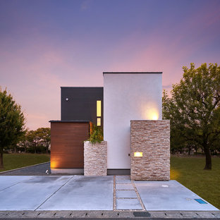 Idee per la facciata di una casa unifamiliare multicolore contemporanea con tetto piano e rivestimento in legno