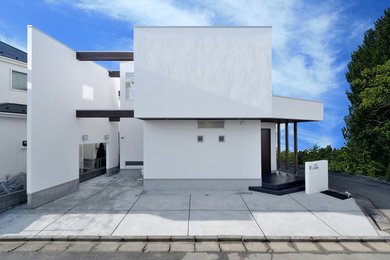 Modelo de fachada de casa blanca minimalista a niveles