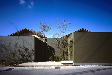 Imagen de fachada de casa asiática de una planta